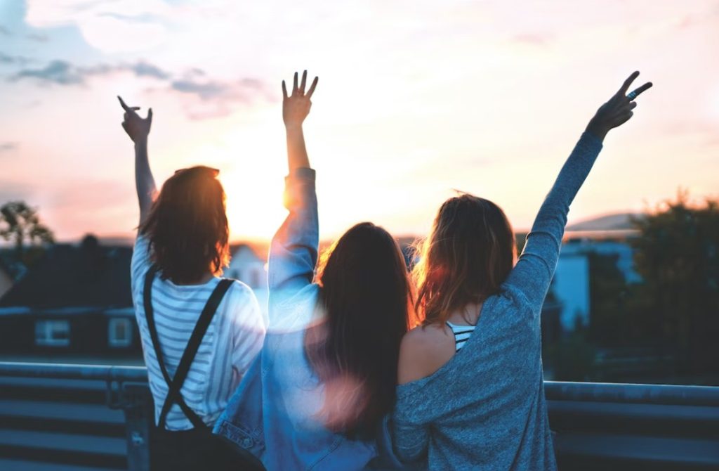 3 happy girls in road